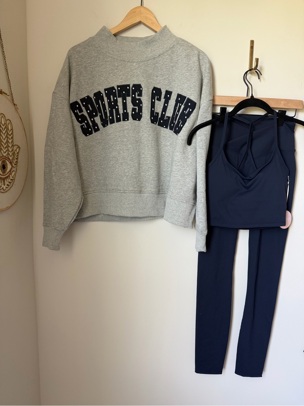 Grey sports club mock neck sweatshirt and navy blue sports bra and leggings set